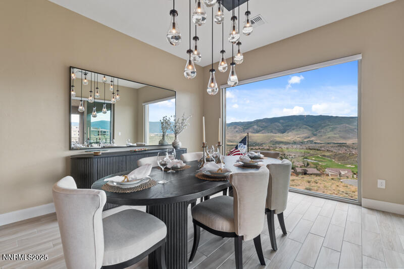 8900 Suncreek Court Reno, NV 89523 - Photo 18 of 74 a view of a dining room with furniture window and wooden floor