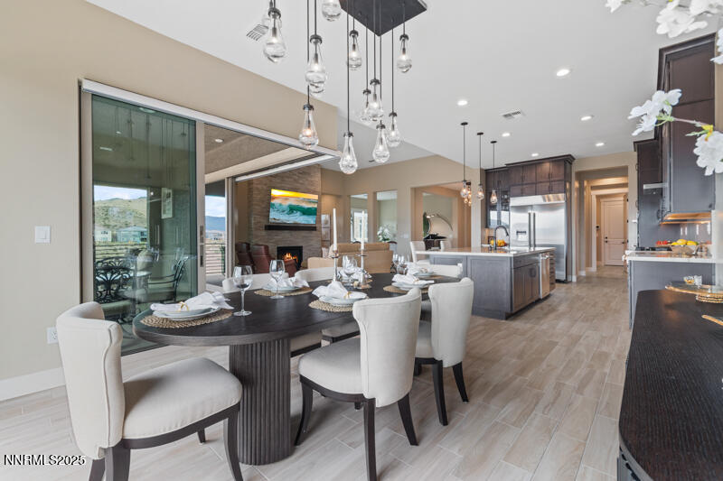 8900 Suncreek Court Reno, NV 89523 - Photo 21 of 74 a view of a dining room with furniture window and wooden floor