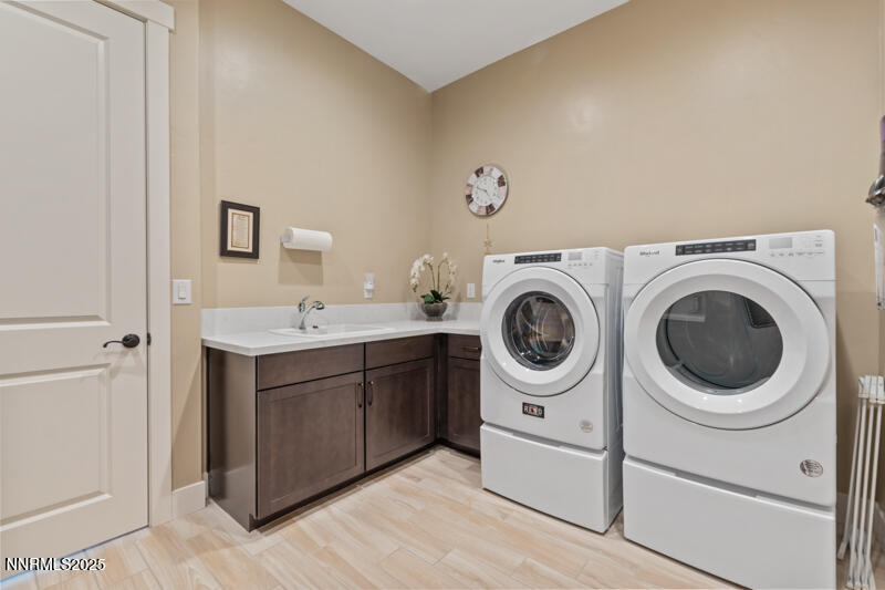 8900 Suncreek Court Reno, NV 89523 - Photo 25 of 74 a utility room with sink dryer and washer