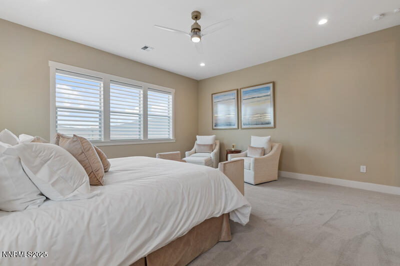 8900 Suncreek Court Reno, NV 89523 - Photo 28 of 74 a bedroom with two beds chandelier and a window