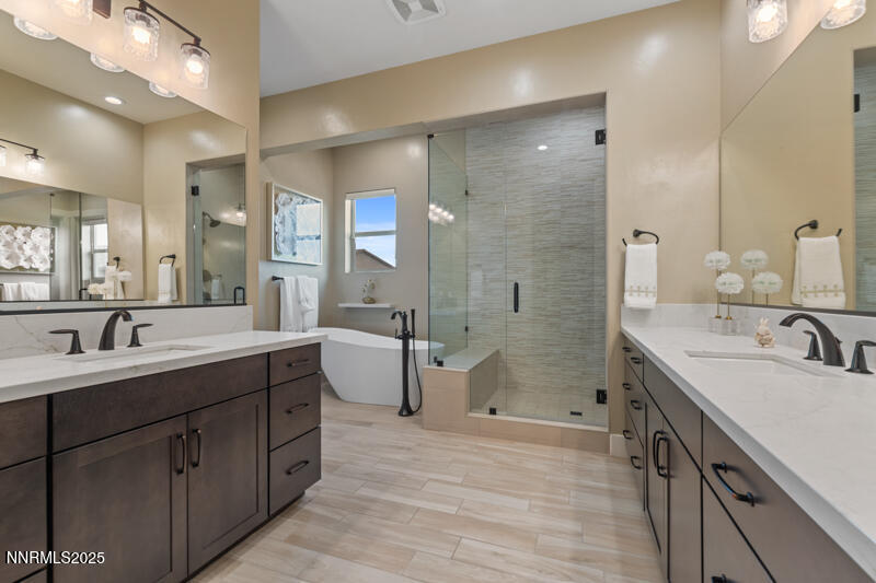 8900 Suncreek Court Reno, NV 89523 - Photo 29 of 74 a spacious bathroom with a double vanity sink mirror double and shower