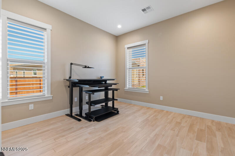 8900 Suncreek Court Reno, NV 89523 - Photo 33 of 74 a view of an empty room with a window and wooden floor