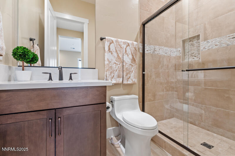 8900 Suncreek Court Reno, NV 89523 - Photo 35 of 74 a bathroom with a sink a toilet and shower