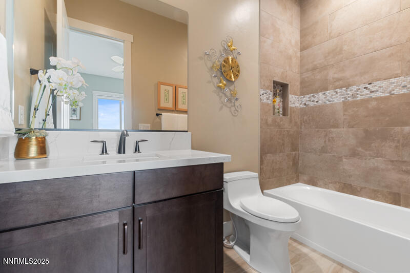 8900 Suncreek Court Reno, NV 89523 - Photo 37 of 74 a bathroom with a sink a toilet and shower