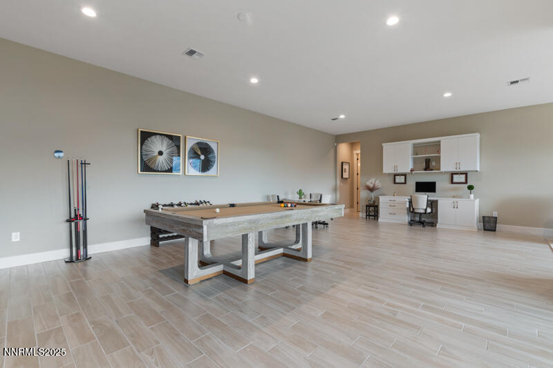 8900 Suncreek Court Reno, NV 89523 - Photo 38 of 74 a view of a room with furniture and wooden floor