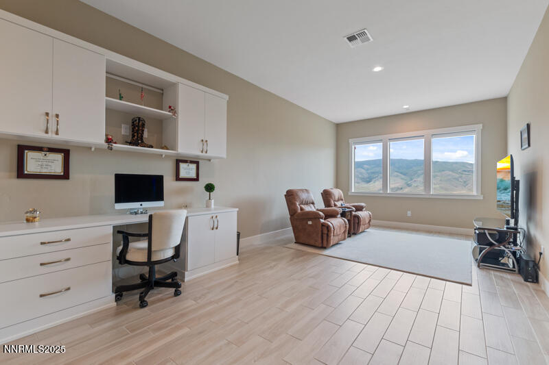 8900 Suncreek Court Reno, NV 89523 - Photo 42 of 74 a living room with furniture and a flat screen tv