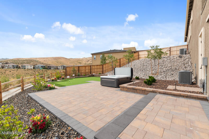 8900 Suncreek Court Reno, NV 89523 - Photo 53 of 74 a view of a patio with a table and chairs under an umbrella