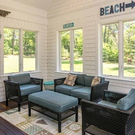 10 Codman Spring Road Edgartown, MA 02539 - Photo 14 of 32 a living room with furniture and a large window