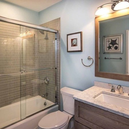 10 Codman Spring Road Edgartown, MA 02539 - Photo 16 of 32 a bathroom with a sink a toilet and shower