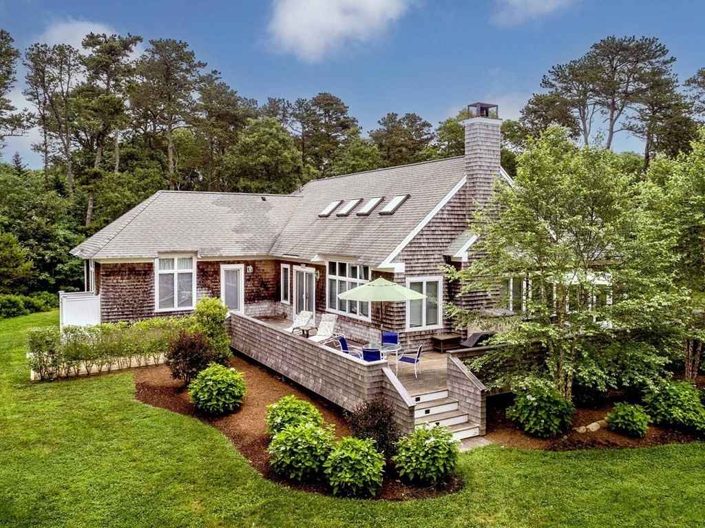 10 Codman Spring Road Edgartown, MA 02539 - Photo 2 of 32 a aerial view of a house next to a big yard and large trees