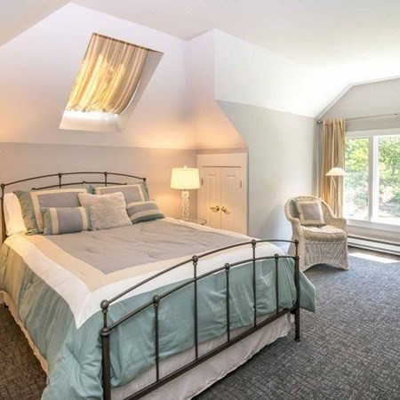 10 Codman Spring Road Edgartown, MA 02539 - Photo 22 of 32 a bedroom with a bed and a couch