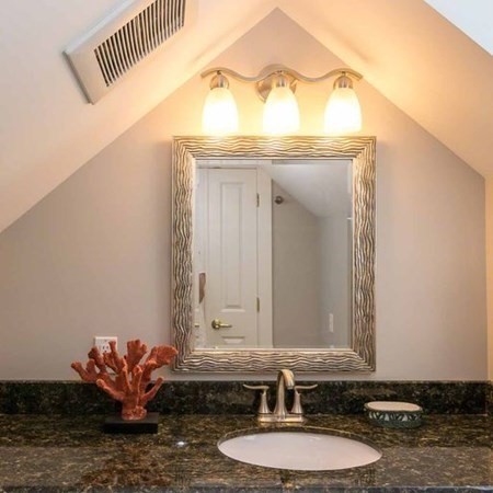 10 Codman Spring Road Edgartown, MA 02539 - Photo 23 of 32 a bathroom with a sink and a mirror