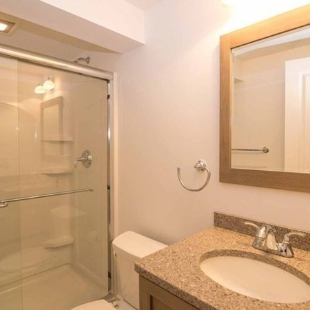 10 Codman Spring Road Edgartown, MA 02539 - Photo 25 of 32 a bathroom with a granite countertop sink toilet and shower