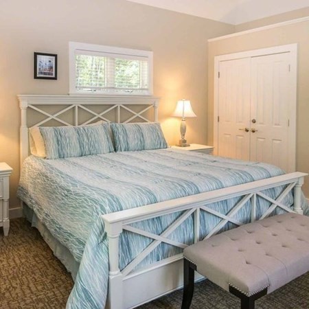 10 Codman Spring Road Edgartown, MA 02539 - Photo 28 of 32 a bedroom with a bed and wooden floor