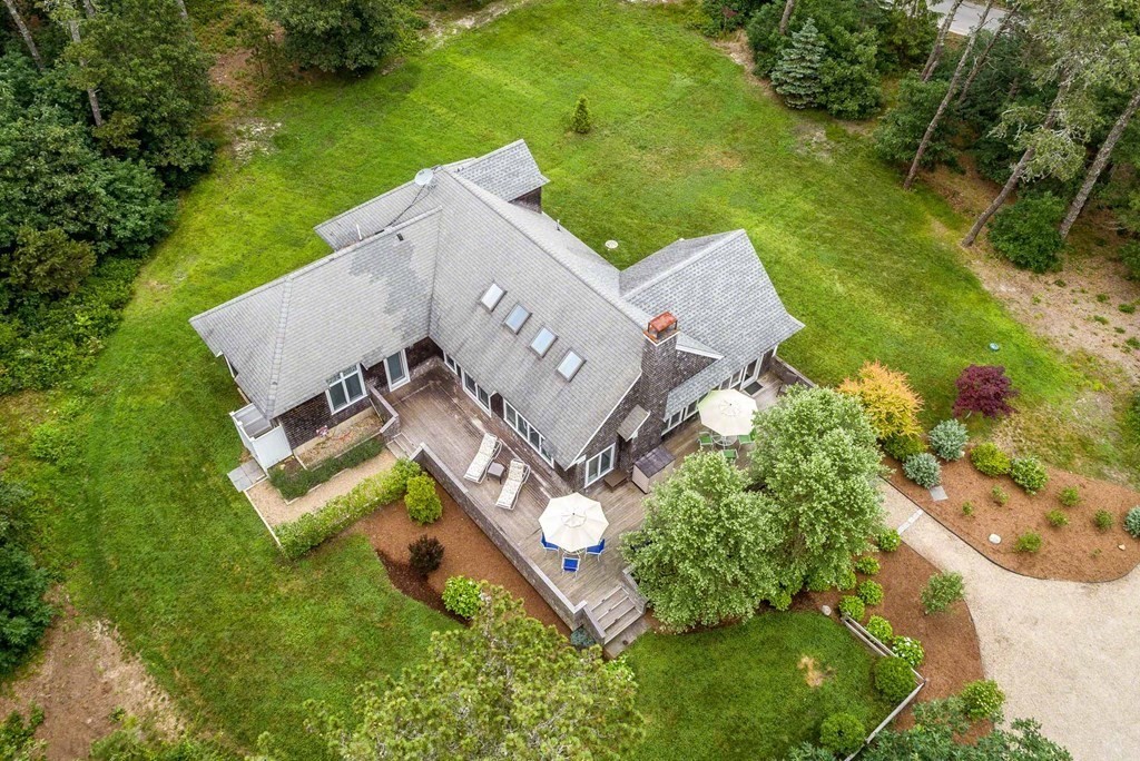 10 Codman Spring Road Edgartown, MA 02539 - Photo 5 of 32 an aerial view of a house with a garden and swimming pool