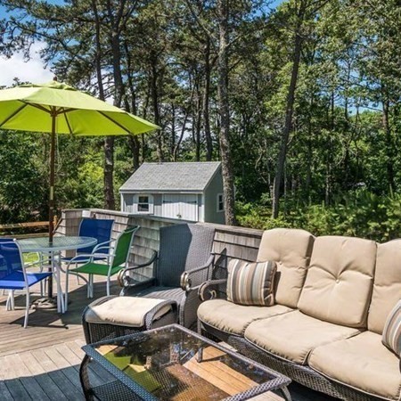 10 Codman Spring Road Edgartown, MA 02539 - Photo 8 of 32 a backyard of a house with seating space