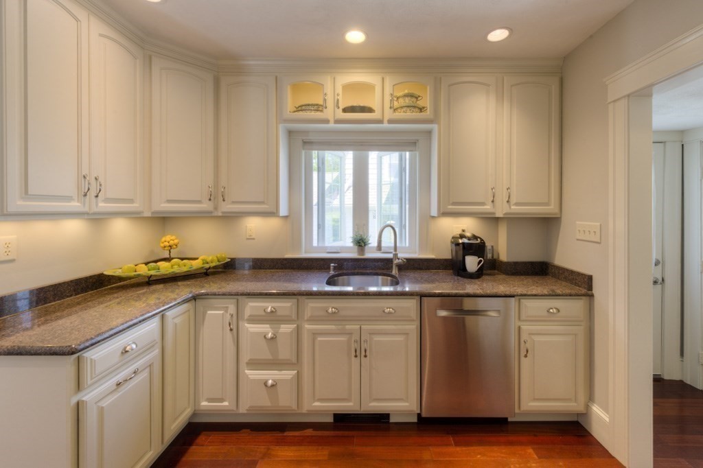 46 Eagle Road Worcester, MA 01605 - Photo 12 of 42 a kitchen with granite countertop white cabinets and a stainless steel appliances