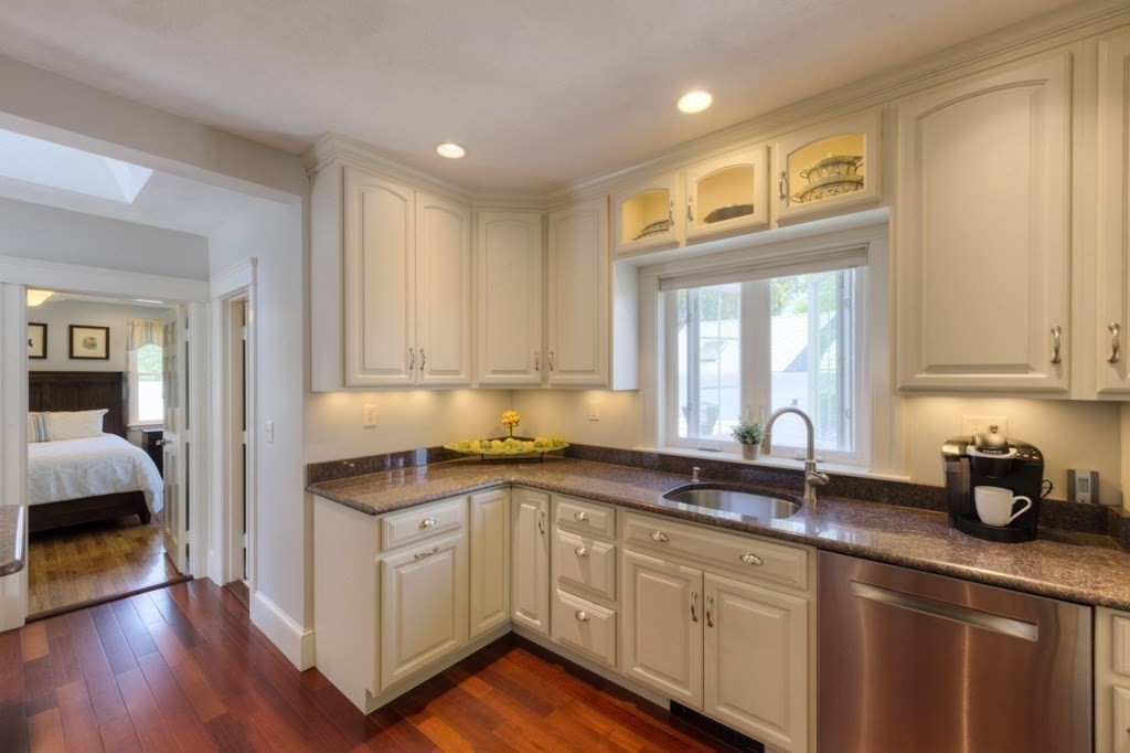 46 Eagle Road Worcester, MA 01605 - Photo 15 of 42 a kitchen with a sink a window and cabinets