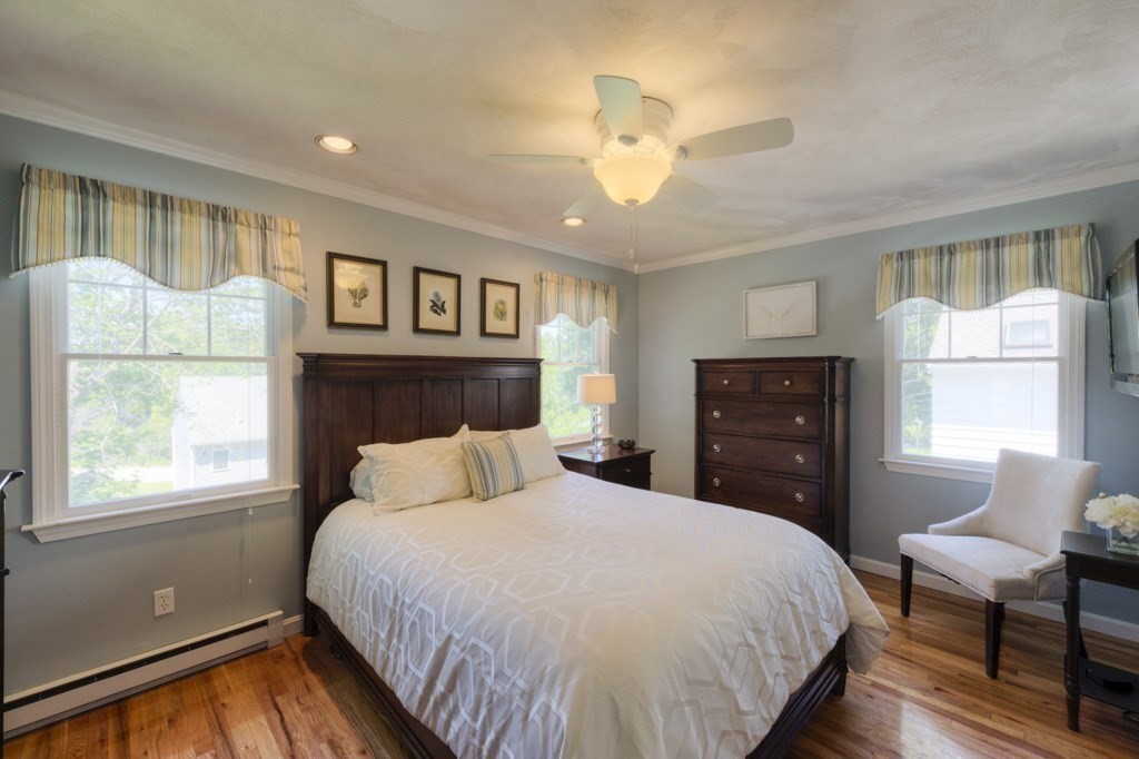 46 Eagle Road Worcester, MA 01605 - Photo 17 of 42 a bedroom with a bed and a chandelier