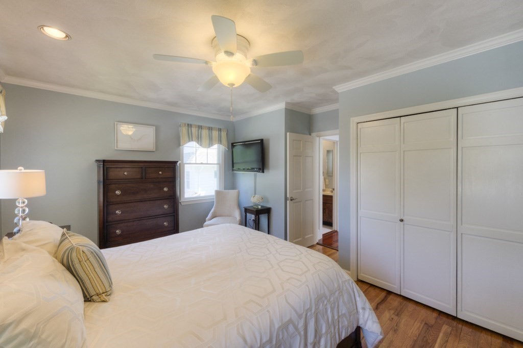 46 Eagle Road Worcester, MA 01605 - Photo 18 of 42 a bedroom with a bed and a chandelier