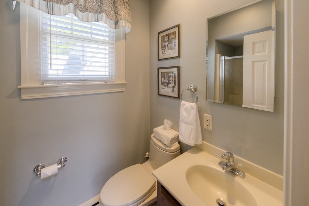 46 Eagle Road Worcester, MA 01605 - Photo 20 of 42 a bathroom with a sink a toilet and a mirror