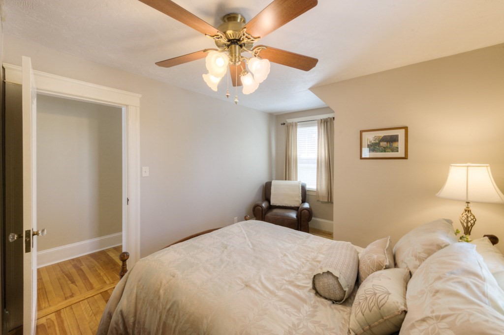 46 Eagle Road Worcester, MA 01605 - Photo 26 of 42 a bedroom with a bed and a chandelier