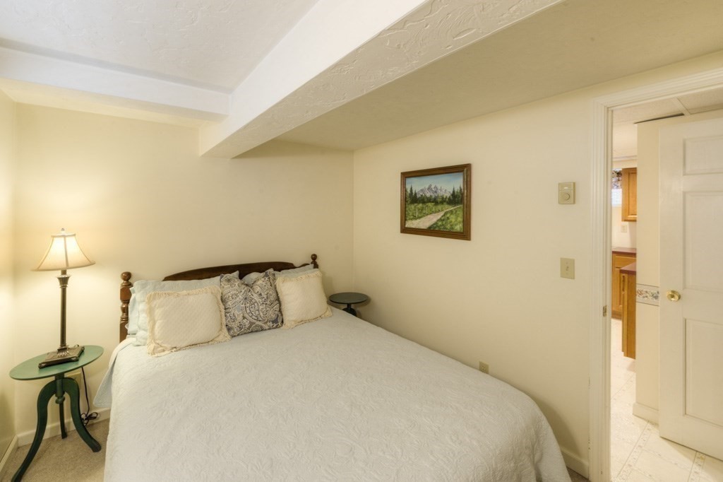 46 Eagle Road Worcester, MA 01605 - Photo 30 of 42 a bedroom with a bed and a painting on the wall