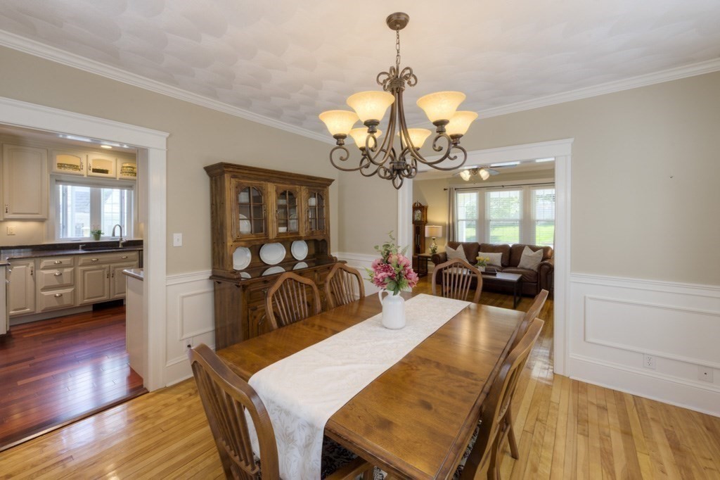 46 Eagle Road Worcester, MA 01605 - Photo 9 of 42 a view of a dining room and livingroom with furniture wooden floor a chandelier