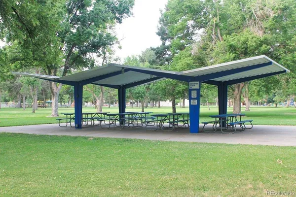 a view of a table and chairs in the garden