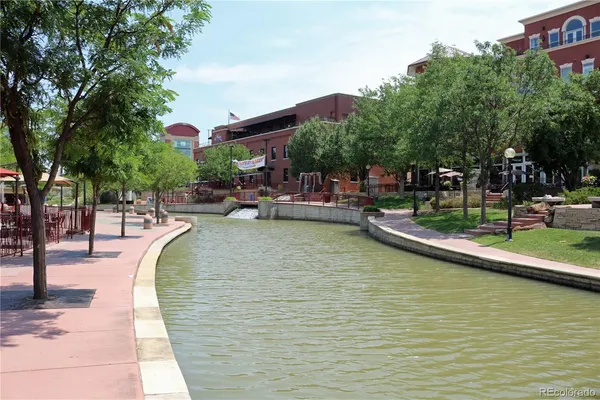 a view of swimming pool with outdoor seating and plants