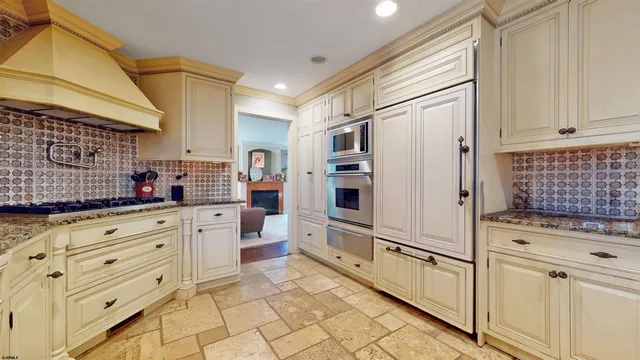 a bathroom with a sink a toilet a mirror and shower