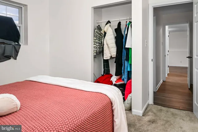 a bedroom with a bed and a television