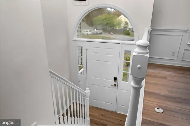 a view of entryway with wooden floor