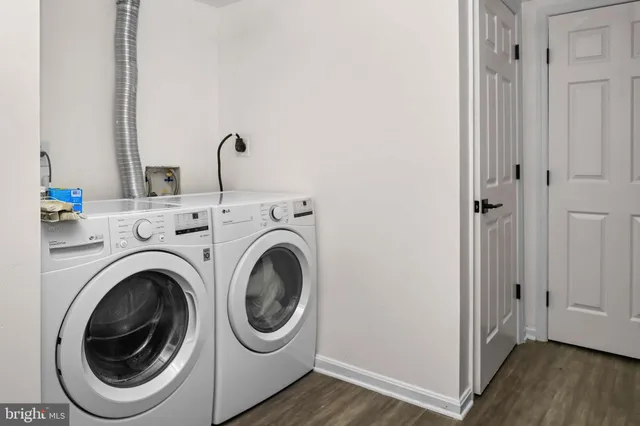 a view of a hallway with washer and dryer