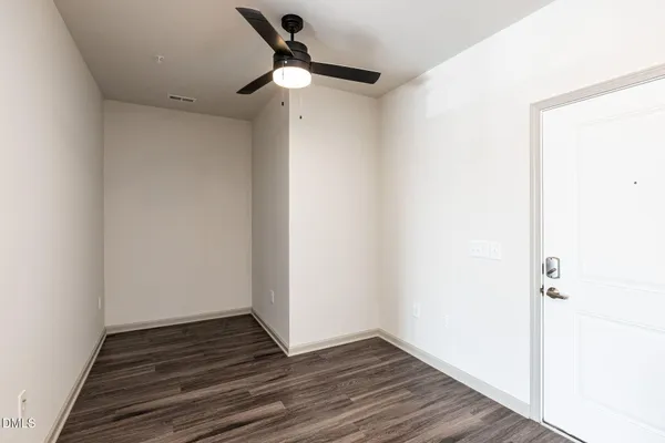 a view of a room with wooden floor