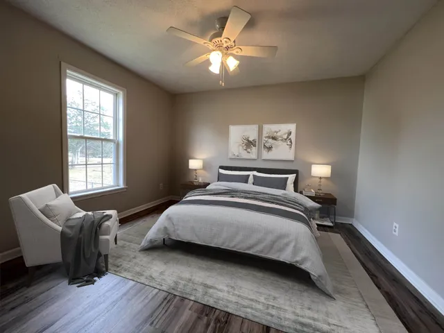 a bedroom with bed and window