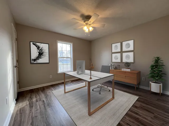a view of a livingroom with furniture and window