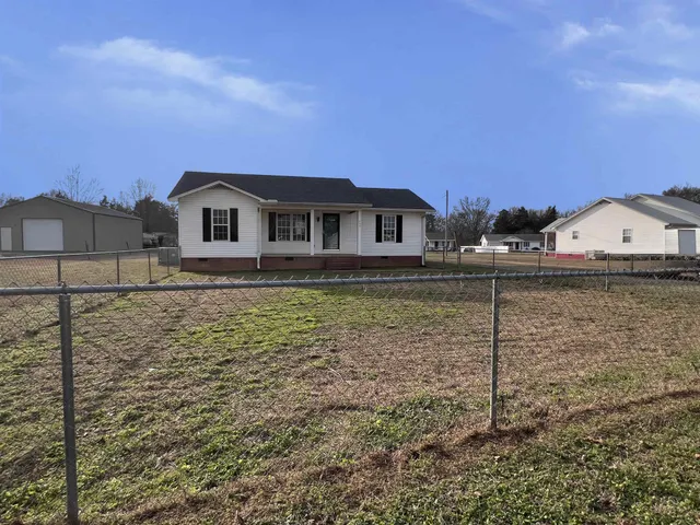 a house view with a garden space