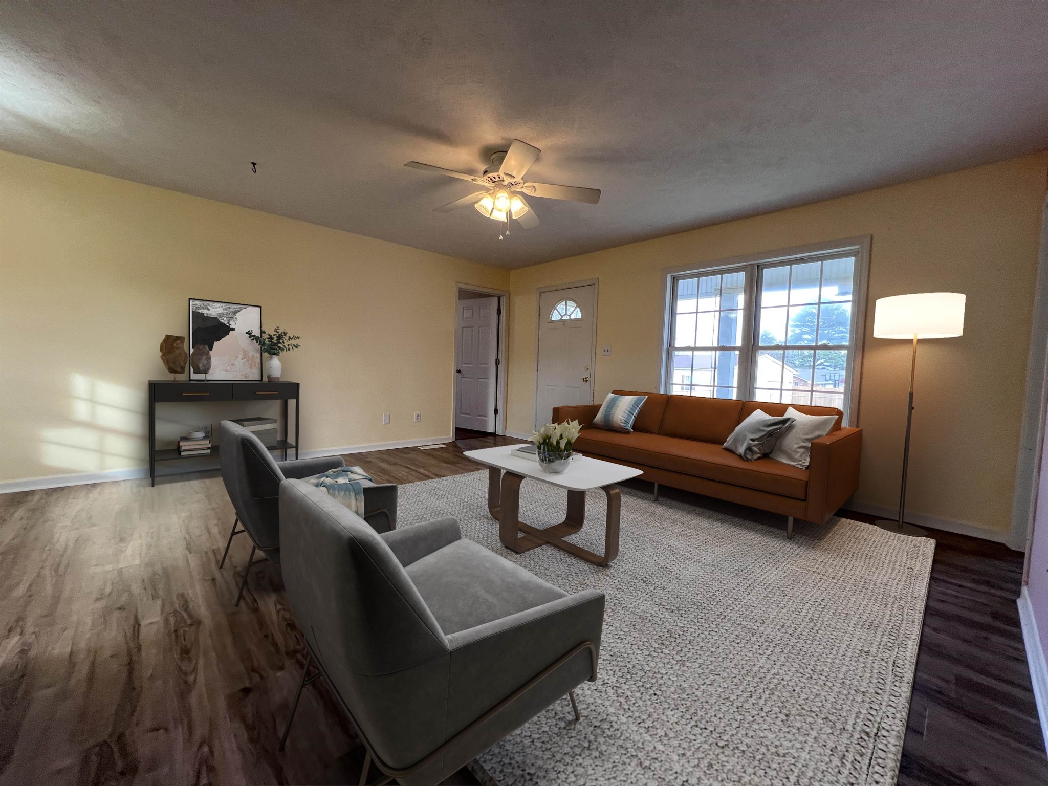 530 Stout Street Savannah, TN 38372 - Photo 3 of 39 a living room with furniture and wooden floor
