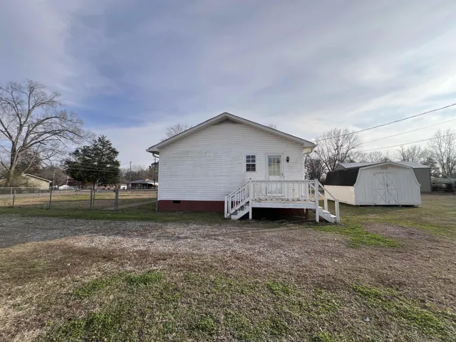 a view of a house with a back yard