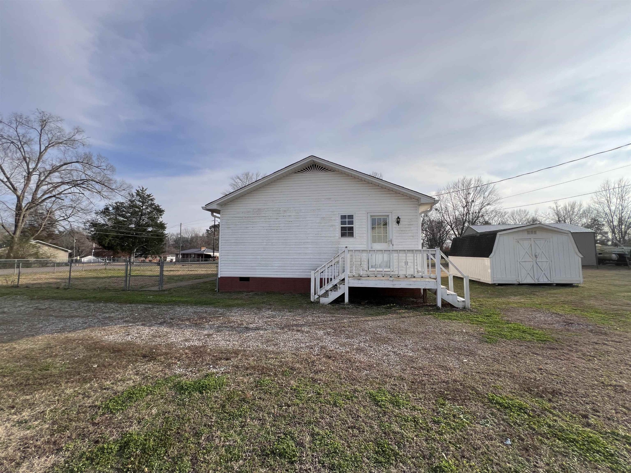 530 Stout Street Savannah, TN 38372 - Photo 31 of 39 a view of a house with a back yard