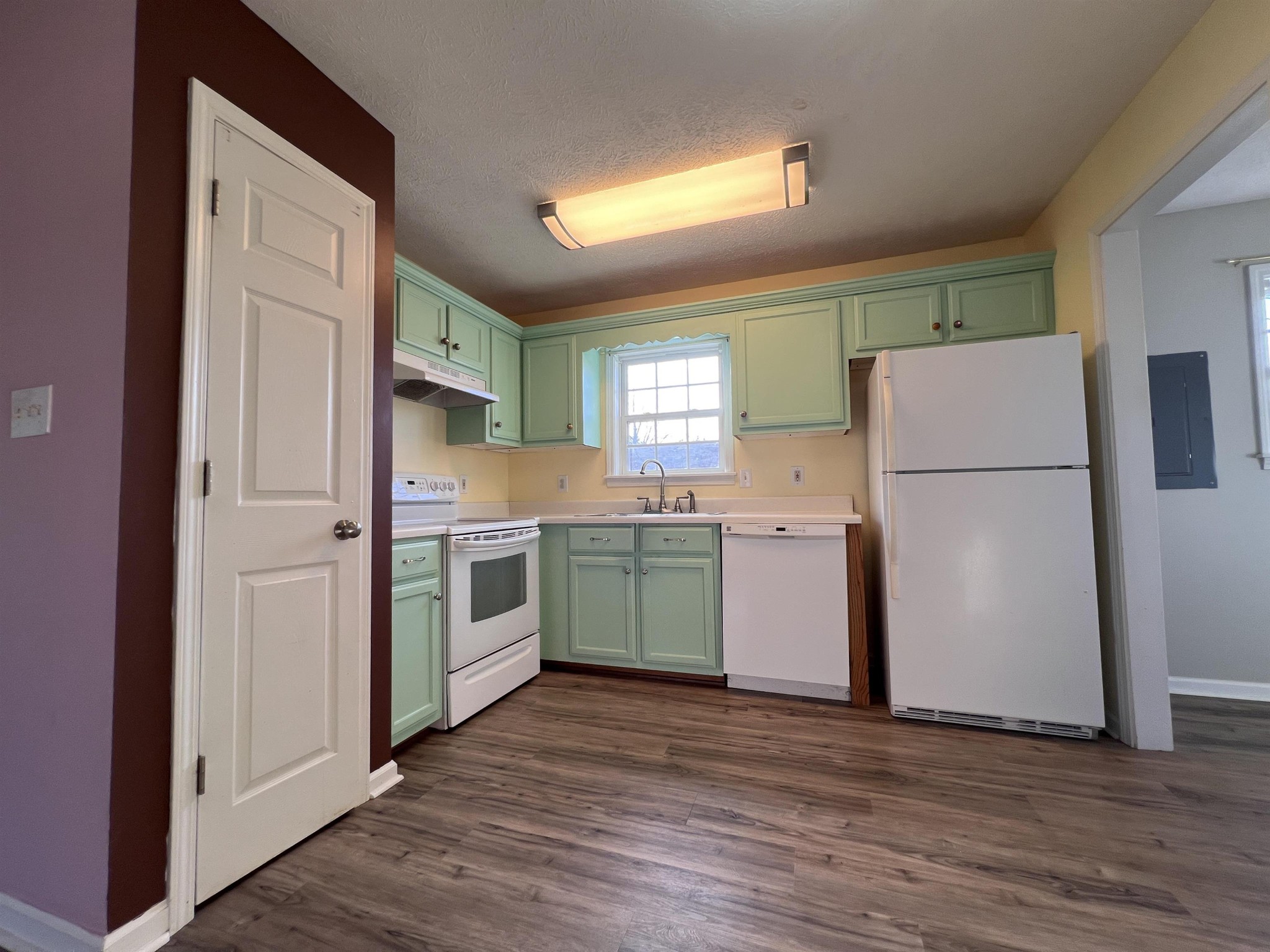 530 Stout Street Savannah, TN 38372 - Photo 10 of 39 a kitchen with a sink a refrigerator and a stove