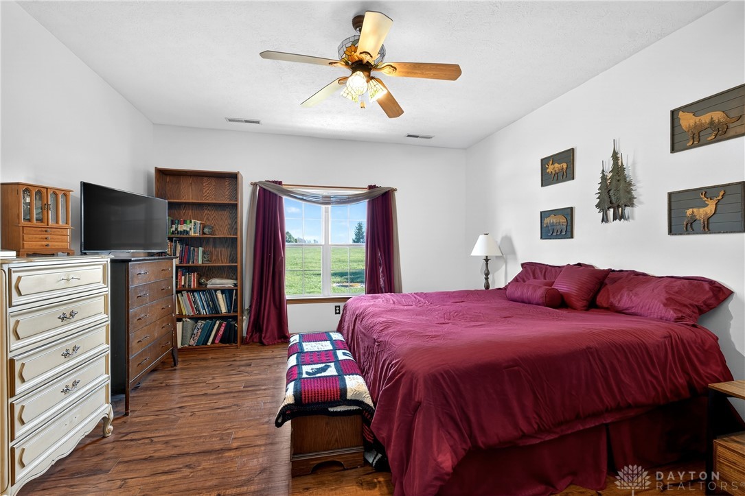 6560 Snyder Road Fletcher, OH 45326 - Photo 27 of 71 This spacious bedroom offers comfortable living with warm flooring and ample natural light.