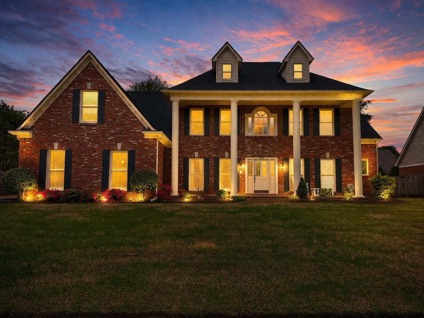 985 Collingham Cove Collierville, TN 38017 - Photo 2 of 17 a front view of a house with a garden