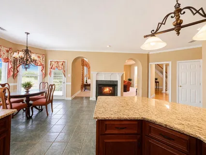 a view of living room with furniture and chandelier