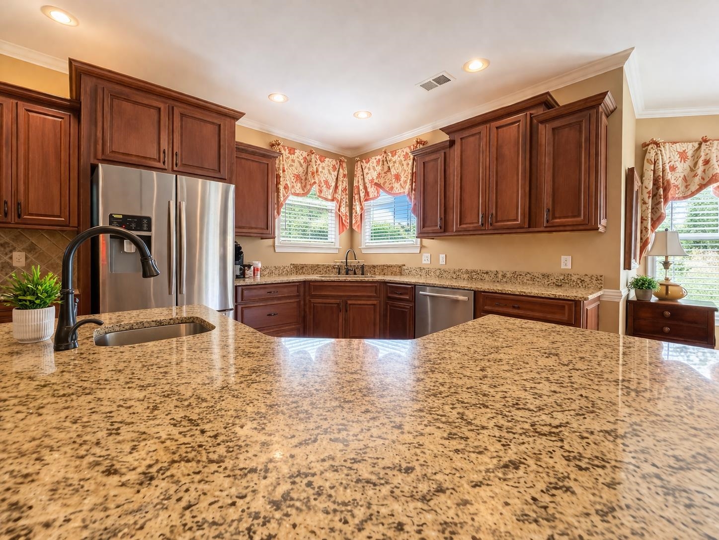 985 Collingham Cove Collierville, TN 38017 - Photo 6 of 17 a large kitchen with kitchen island granite countertop a granite counter tops and a sink