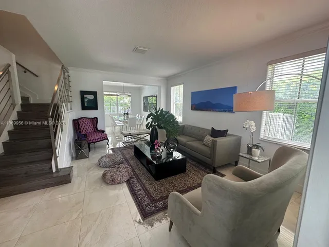 a view of a dining room with furniture window and outside view
