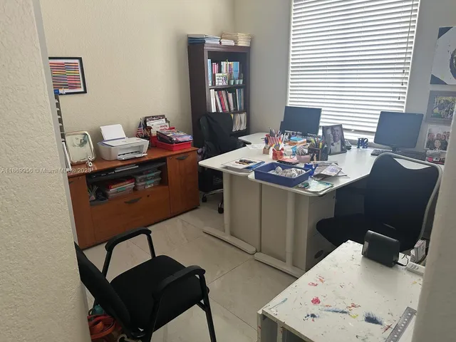 a children room with furniture and a window