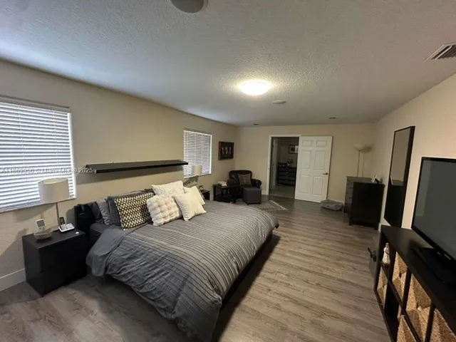 a room with a bed and furniture