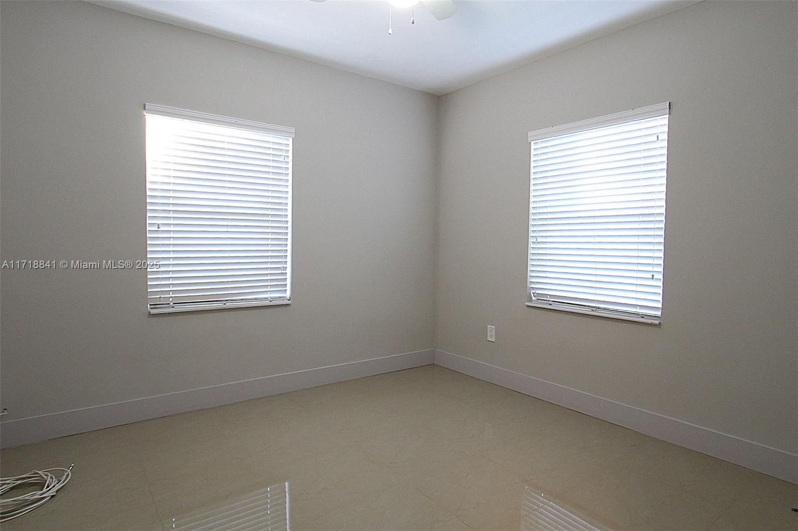 14340 Graves Drive Miami, FL 33176 - Photo 11 of 16 an empty room with a window
